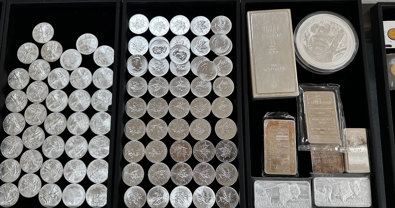 Trays of silver rounds, coins, and bars